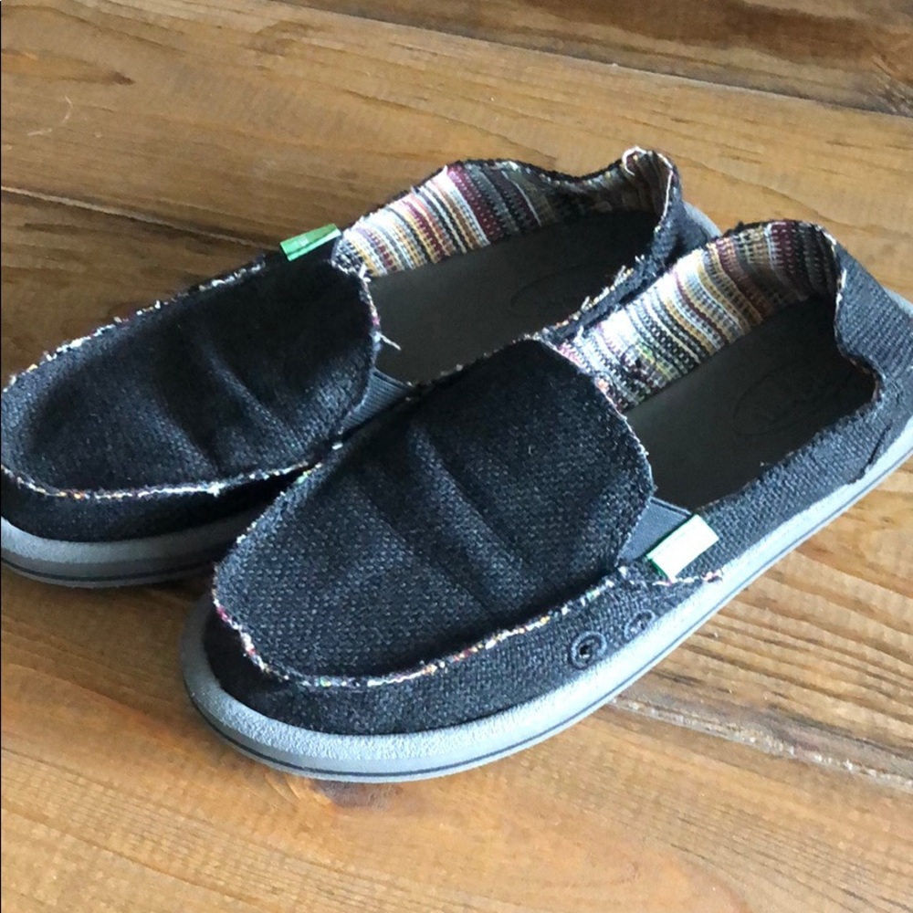 Sanuk black slipons
